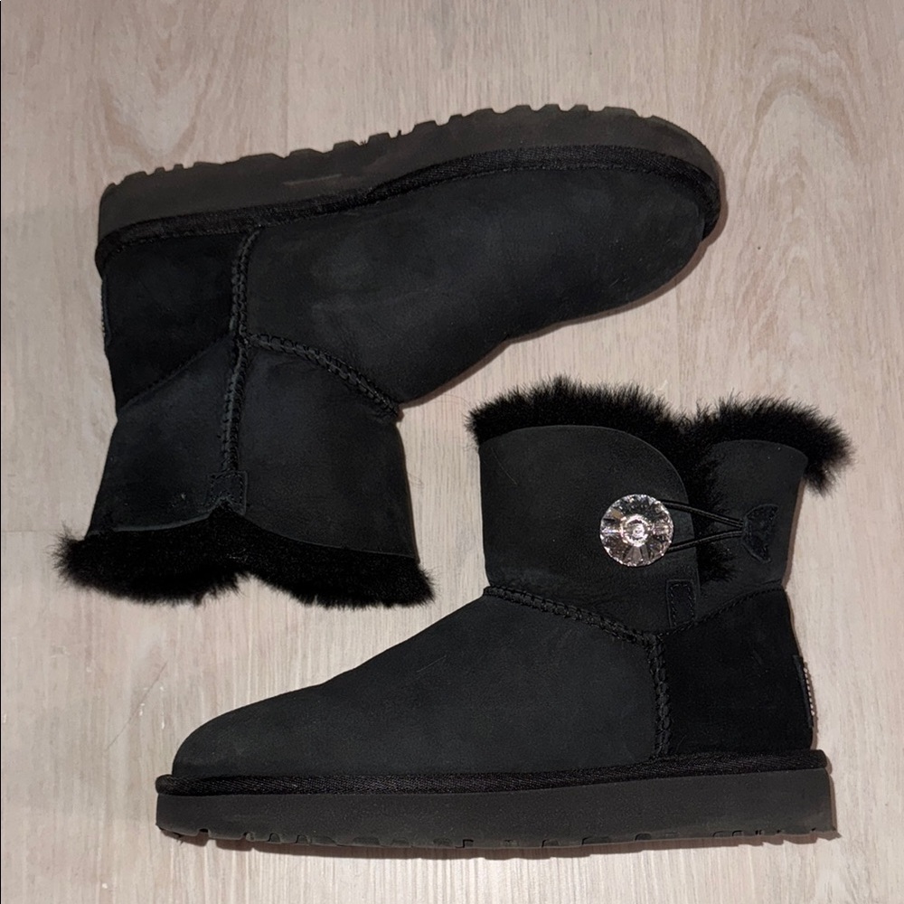 Black UGG boots with crystal button